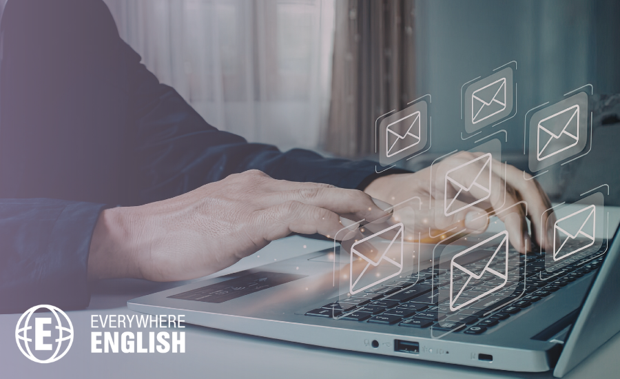 Hands typing on a laptop keyboard with digital icons of an envelope symbol overlaid, representing email communication or networking and highlighting Email Etiquette: Phrases to Use When Writing Emails For Work.